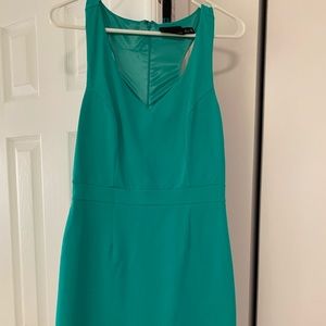 Green fitted dress.